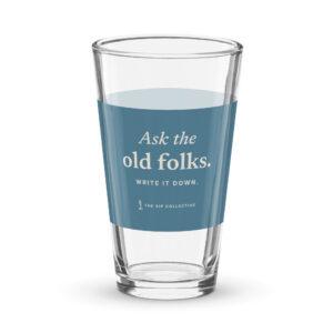 Clear pint glass with a blue band printed "Ask the old folks"